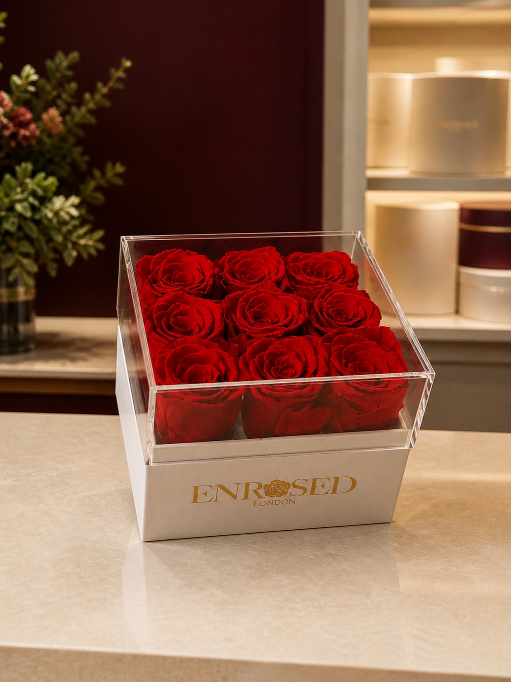 Nine preserved red roses in a square acrylic flowerbox